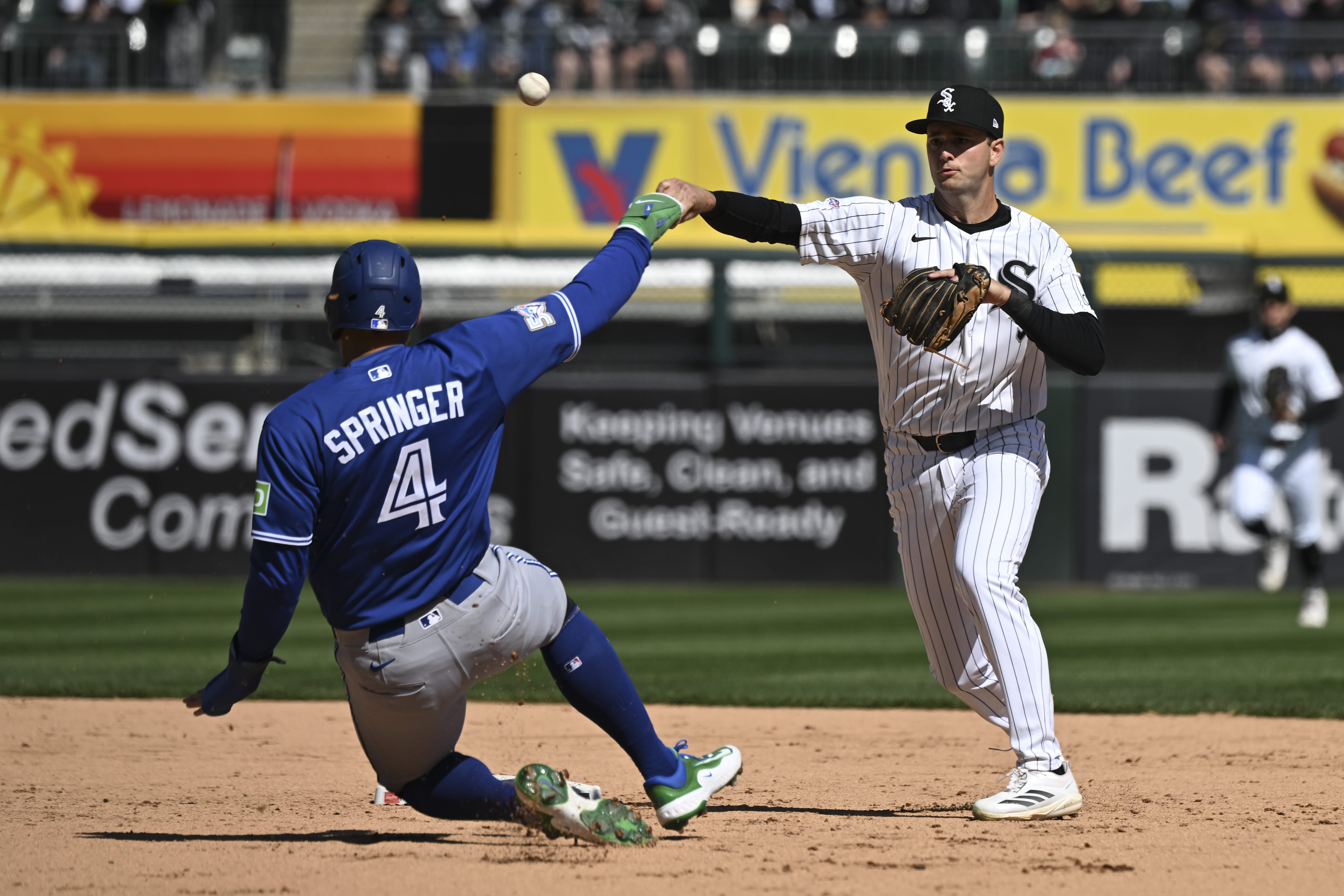 Apr 5, 2026; Chicago, Illinois, USA; Chicago White Sox shortstop Tanner Murphy throws a double play after forcing out Toronto Blue Jays right fielder George Springer (4) during the fifth inning at Rate Field.