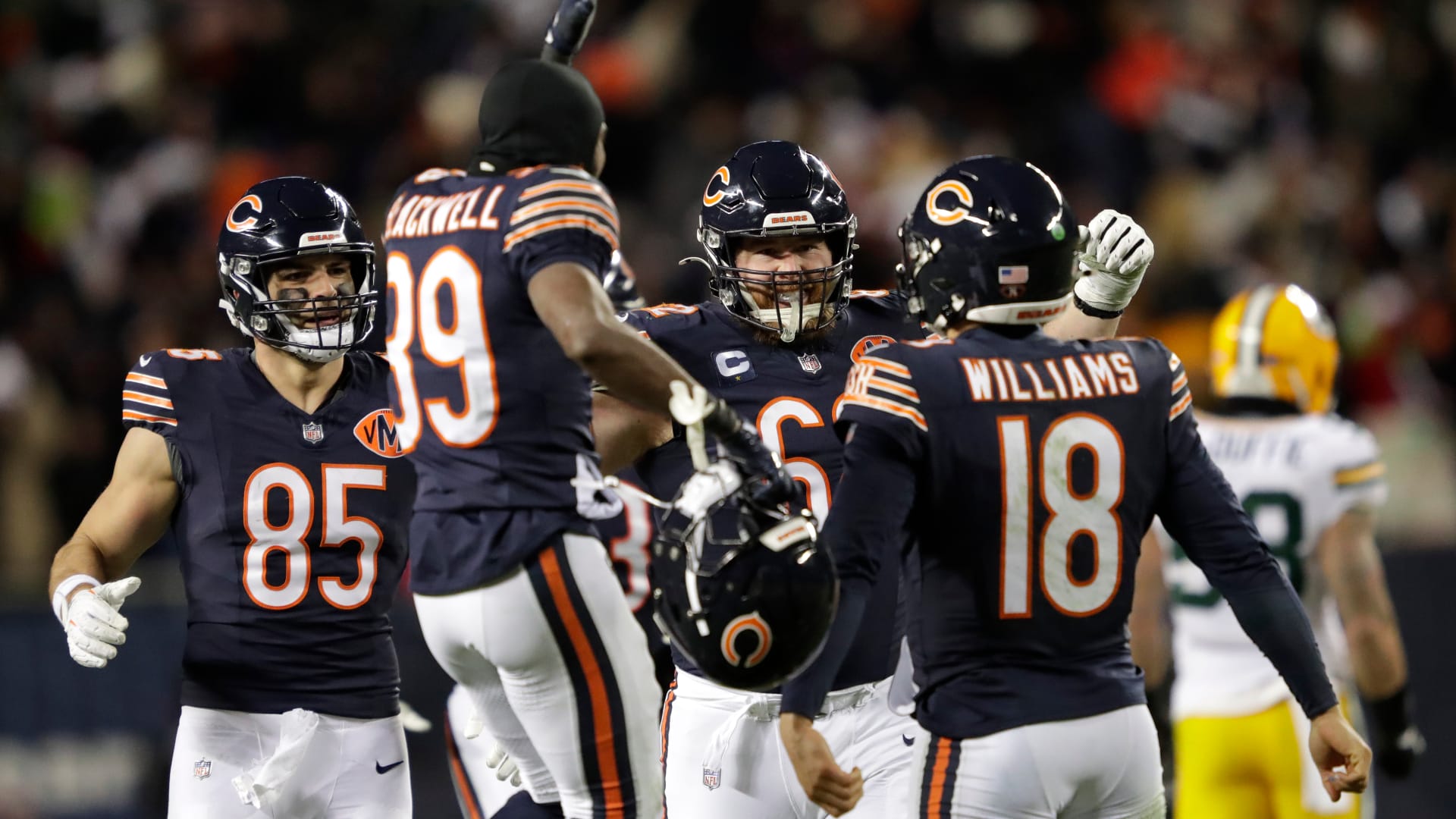 Dec 20, 2025; Chicago, Illinois, USA; Chicago Bears quarterback Caleb Williams (18) is swarmed by teammates after throwing the game-winning touchdown pass in overtime against the Green Bay Packers during their football game at Soldier Field. Mandatory Credit: Dan Powers
