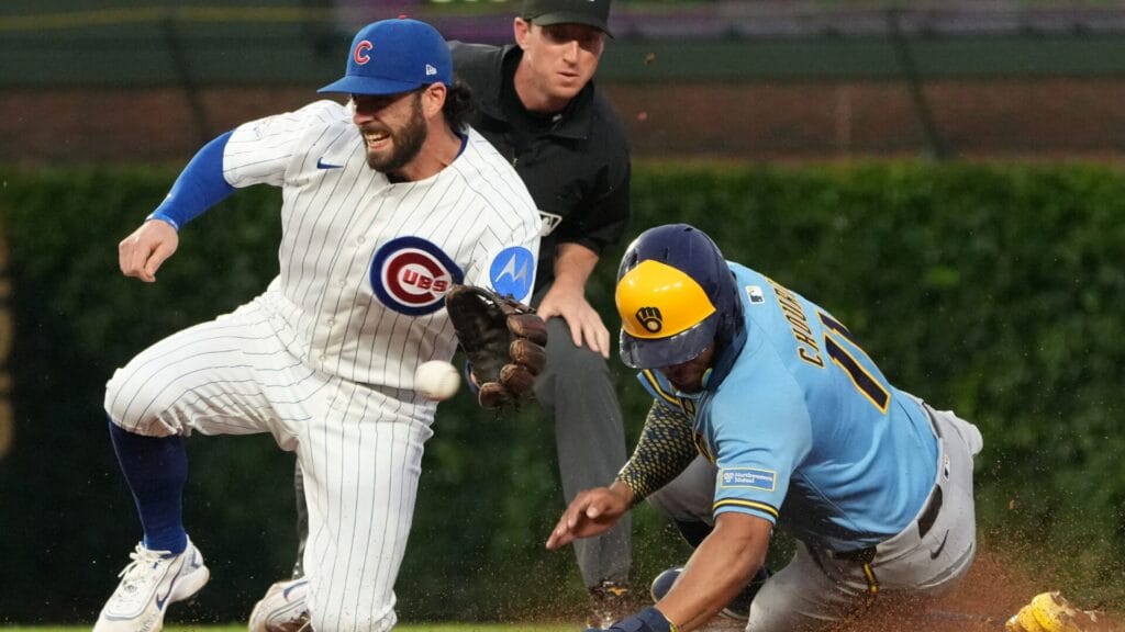 Milwaukee Brewers left fielder Jackson Chourio steals second base as Chicago Cubs shortstop Dansby Swanson takes a throw at Wrigley Field. (David Banks-Imagn Images)