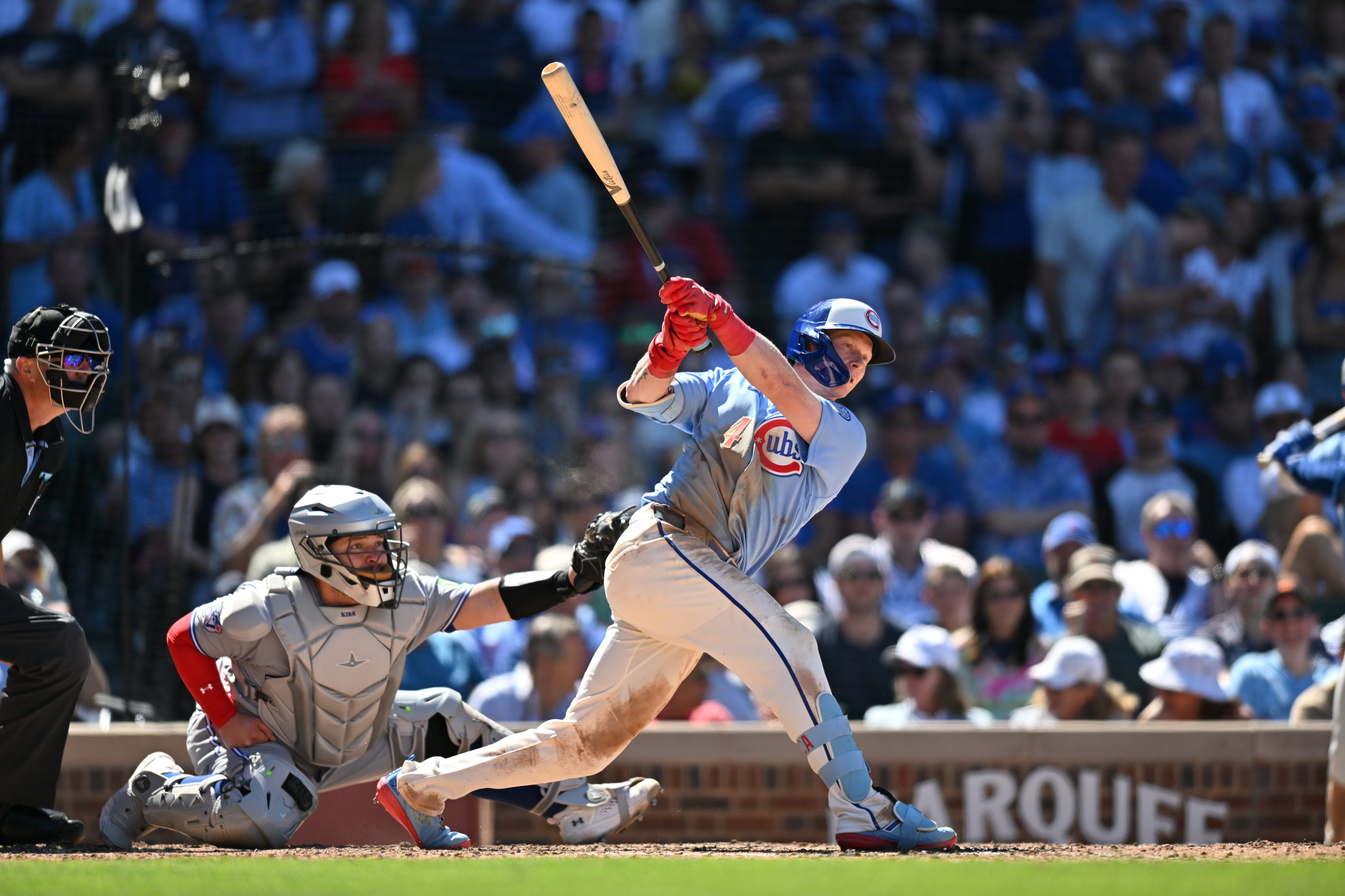 Jun 19, 2026; Chicago, Illinois, USA; Chicago Cubs center fielder Pete Crow-Armstrong (4) hits an RBI single against the Toronto Blue Jays during the sixth inning at Wrigley Field.