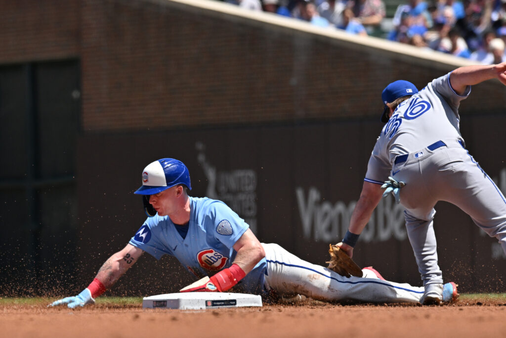 Jun 19, 2026; Chicago, Illinois, USA; Chicago Cubs center fielder Pete Crow-Armstrong (4) steals second base against Toronto Blue Jays second baseman Davis Schneider (36) during the first inning at Wrigley Field.