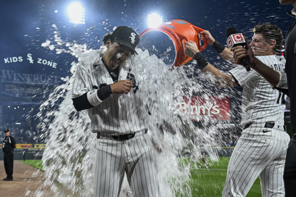 Jun 23, 2026; Chicago, Illinois, USA; Chicago White Sox third baseman Miguel Vargas (20) gets doused by second baseman Chase Meidroth (10) after the game against the Cleveland Guardians at Rate Field.