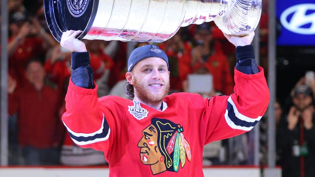 Jun 15, 2015; Chicago, IL, USA; Chicago Blackhawks right wing Patrick Kane hoists the Stanley Cup after defeating the Tampa Bay Lightning in game six of the 2015 Stanley Cup Final at United Center. Mandatory Credit: Dennis Wierzbicki-Imagn Images