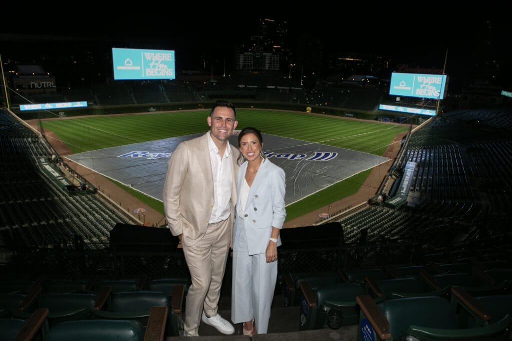 Matt and Ashley Boyd at Wrigley Field during a charity fundraising event for Kingdom Home.
