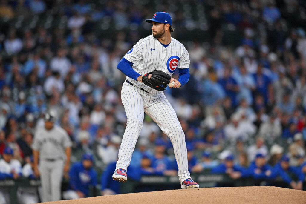 Aug 1, 2026; Chicago, Illinois, USA; Chicago Cubs pitcher David Peterson (19) pitches during the first inning against the New York Yankees at Wrigley Field.