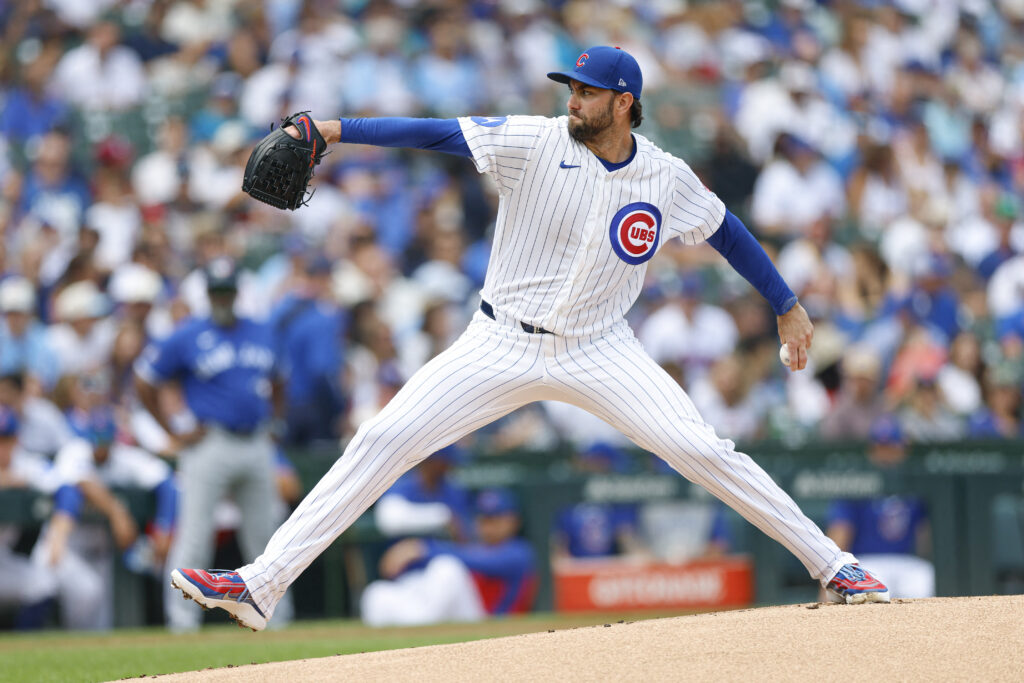 Aug 6, 2026; Chicago, Illinois, USA; Chicago Cubs starting pitcher David Peterson (19) delivers a pitch against the Toronto Blue Jays during the first inning at Wrigley Field.