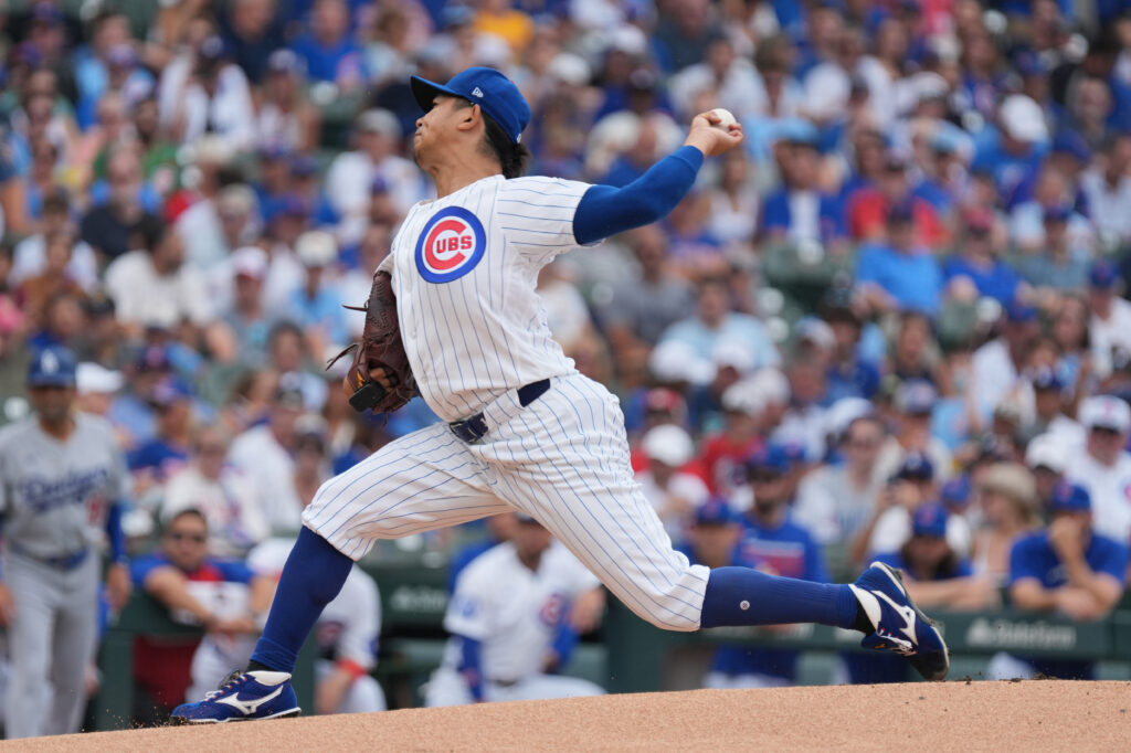 Aug 5, 2026; Chicago, Illinois, USA; Chicago Cubs pitcher Shota Imanaga (18) throws the ball against the Los Angeles Dodgers during the first inning at Wrigley Field.