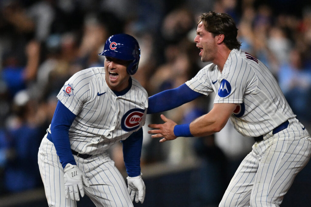 Aug 18, 2026; Chicago, Illinois, USA; Chicago Cubs third baseman Alex Bregman (3) celerates with shortstop Nico Hoerner (2) after hitting a walk-off RBI single against the Chicago White Sox during the ninth inning at Wrigley Field.