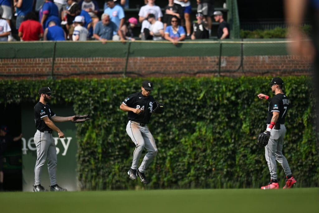 Aug 19, 2026; Chicago, Illinois, USA; Chicago White Sox center fielder Tristan Peters (29), right fielder Braden Montgomery (24) and outfielder Brenton Doyle (7) celerate their victory over the Chicago Cubs at Wrigley Field.