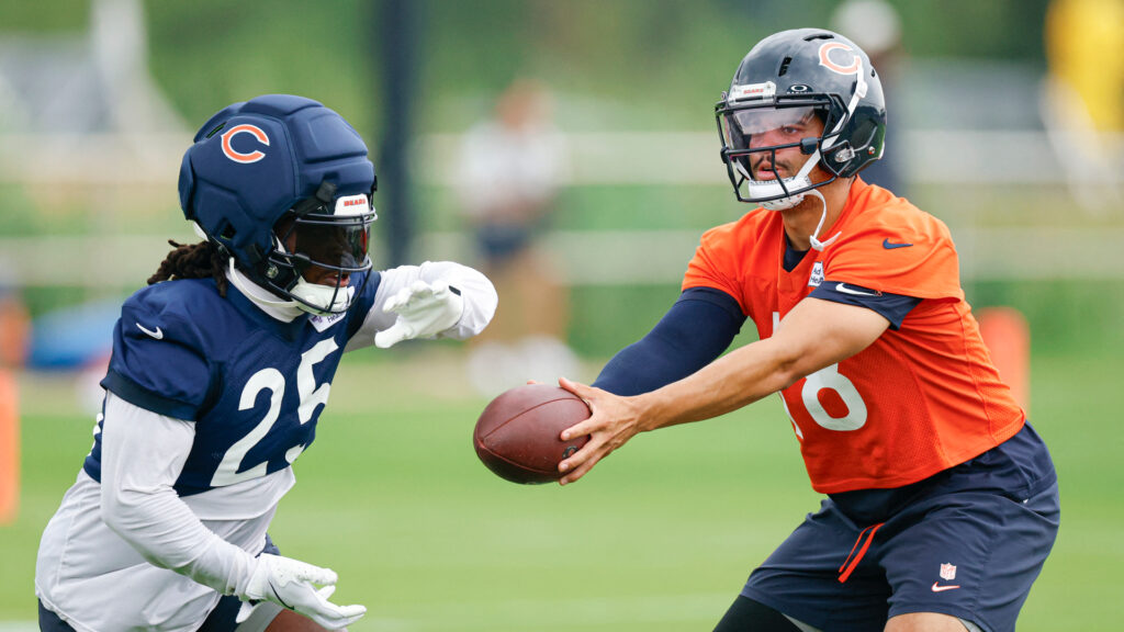 Aug 5, 2026; Lake Forest, IL, USA; Chicago Bears quarterback Caleb Williams (18) passes the ball to running back Kyle Monangai (25) during training camp at Halas Hall. Mandatory Credit: Kamil Krzaczynski-Imagn Images