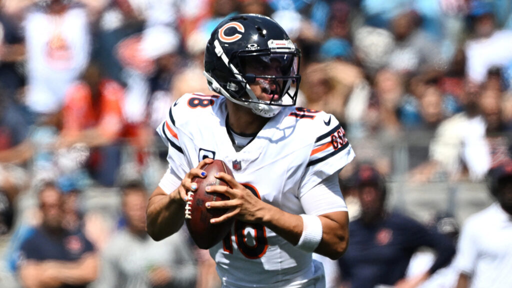 Sep 13, 2026; Charlotte, North Carolina, USA; Chicago Bears quarterback Caleb Williams (18) scrambles before throwing a touchdown pass to tight end Cole Kmet (85) in the second quarter against the Carolina Panthers at Bank of America Stadium. Mandatory Credit: Bob Donnan-Imagn Images