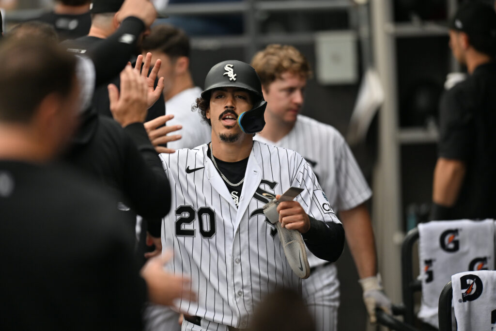 Sep 19, 2026; Chicago, Illinois, USA; Chicago White Sox third baseman Miguel Vargas (20) celebrates with teammates in the dugout after scoring against the Detroit Tigers during the first inning at Rate Field.