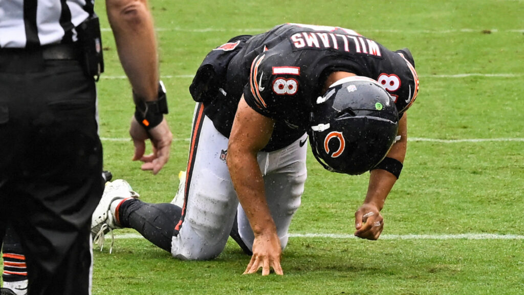 Sep 20, 2026; Chicago, Illinois, USA; Chicago Bears quarterback Caleb Williams (18) kneels on the field with an apparent injury against the Minnesota Vikings during the second half at Soldier Field. Mandatory Credit: Matt Marton-Imagn Images
