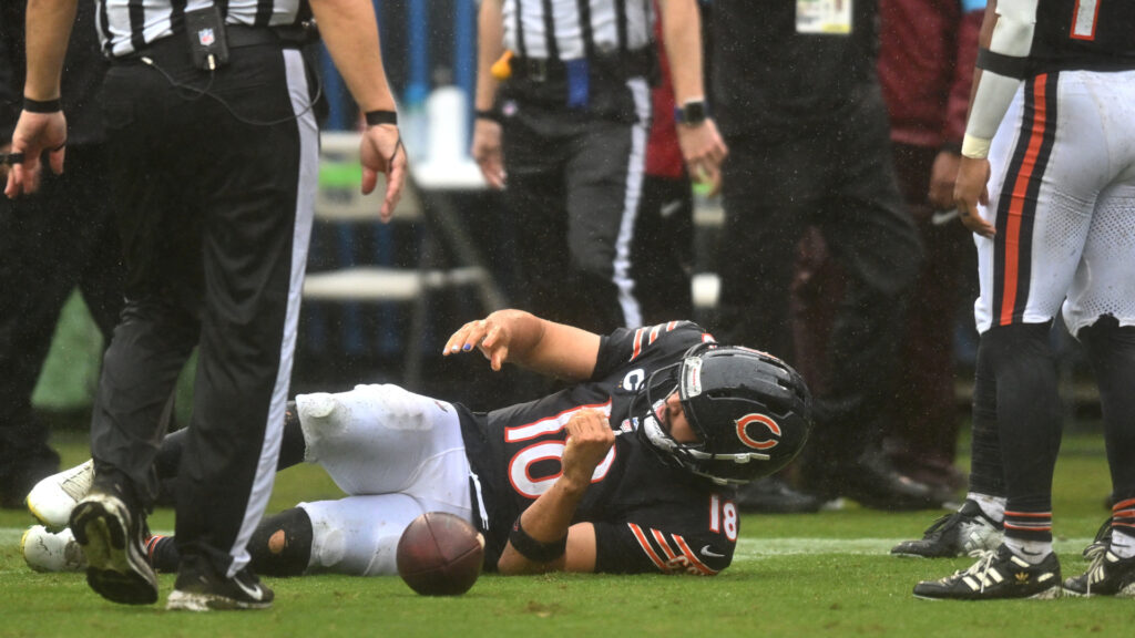 Sep 20, 2026; Chicago, Illinois, USA; Chicago Bears quarterback Caleb Williams (18) lies on the field with an apparent injury against the Minnesota Vikings during the second half at Soldier Field. Mandatory Credit: Patrick Gorski-Imagn Images