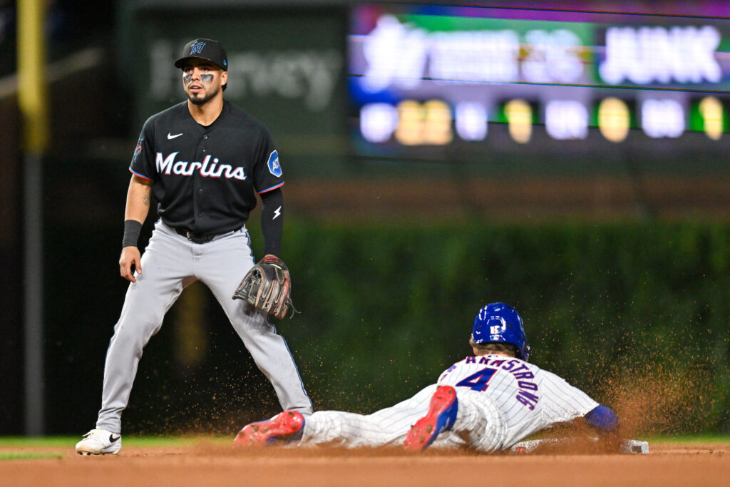 Sep 22, 2026; Chicago, Illinois, USA; Chicago Cubs center fielder Pete Crow-Armstrong (4) slides into second base for the steal against the Miami Marlins during the third inning at Wrigley Field.