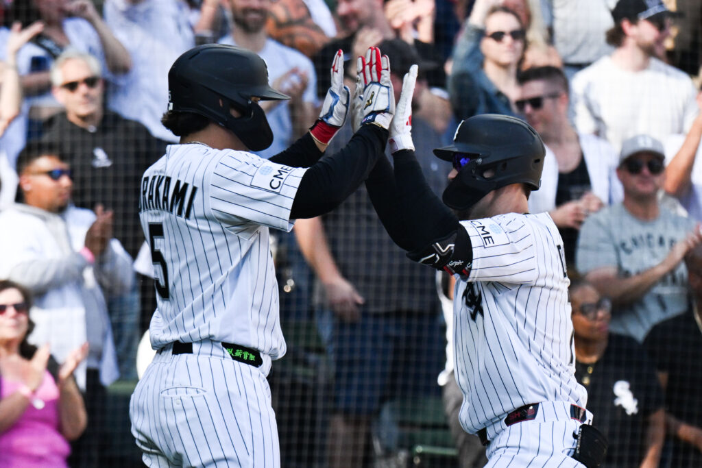 Sep 27, 2026; Chicago, Illinois, USA; Chicago White Sox center fielder Brenton Doyle (7) high fives first baseman Munetaka Murakami (5) after they score on his two run home run during the third inning against the Colorado Rockies at Rate Field.