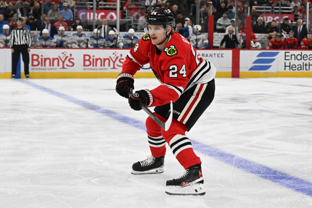 Oct 6, 2026; Chicago, Illinois, USA; Chicago Blackhawks defenseman Bowen Byram (24) defends against the St. Louis Blues during the first period at United Center. Mandatory Credit: Matt Marton-Imagn Images