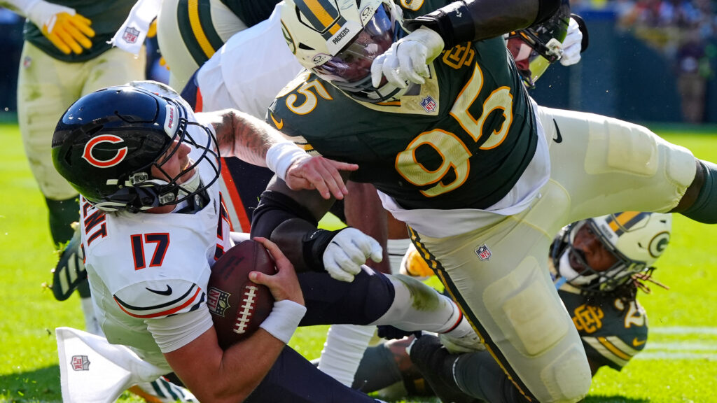Oct 11, 2026; Green Bay, Wisconsin, USA; Green Bay Packers defensive tackle Devonte Wyatt (95) tackles Chicago Bears quarterback Tyson Bagent (17) during the game at Lambeau Field. Mandatory Credit: Wm. Glasheen USAToday Network via IMAGN images