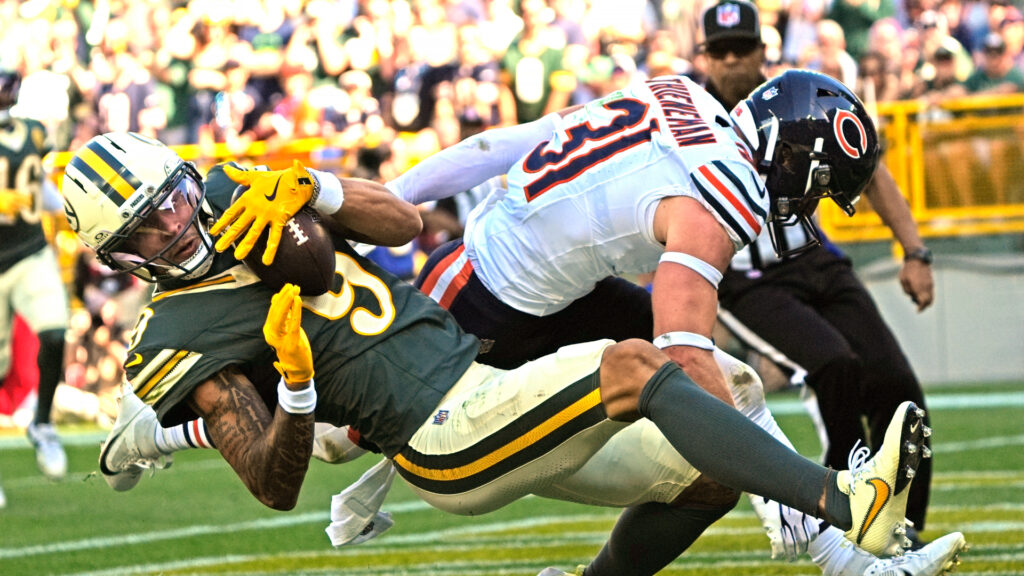 Oct 11, 2026; Green Bay, Wisconsin, USA; Green Bay Packers wide receiver Christian Watson (9) scores a touchdown against Chicago Bears safety Dillon Thieneman (31) during the game. Mandatory Credit: Dan Powers USAToday Network via IMAGN images