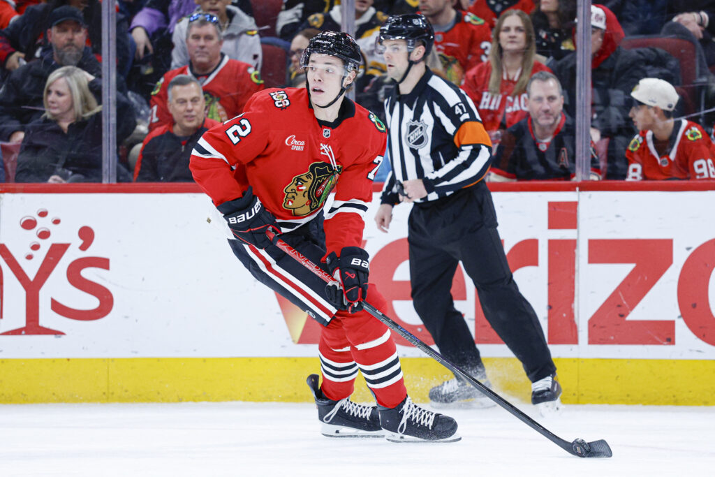 Jan 17, 2026; Chicago, Illinois, USA; Chicago Blackhawks defenseman Alex Vlasic (72) controls the puck against the Boston Bruins during the first period at United Center. Mandatory Credit: Kamil Krzaczynski-Imagn Images