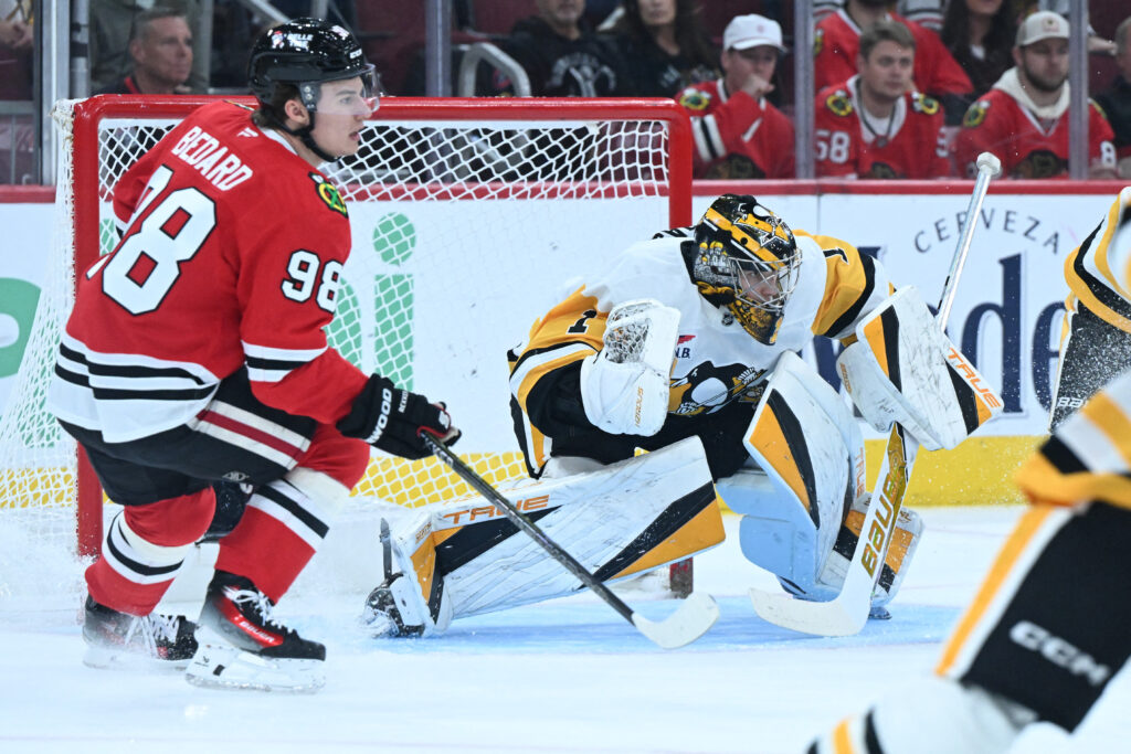 Oct 13, 2026; Chicago, Illinois, USA; Pittsburgh Penguins goaltender Sergei Murashov (1) defends as Chicago Blackhawks center Connor Bedard (98) looks on during the first period at United Center. Mandatory Credit: Matt Marton-Imagn Images
