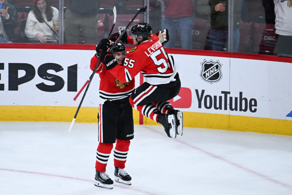 Oct 15, 2026; Chicago, Illinois, USA; Chicago Blackhawks defenseman Artyom Levshunov (55) celebrates with right wing Patrick Kane (88) after he scores the game winning goal during the overtime period against the Winnipeg Jets at the United Center. Mandatory Credit: Matt Marton-Imagn Images