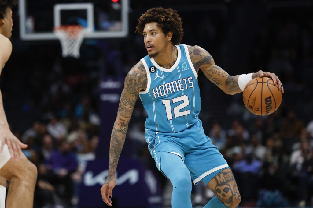 Kelly Oubre dribbling a basketball.