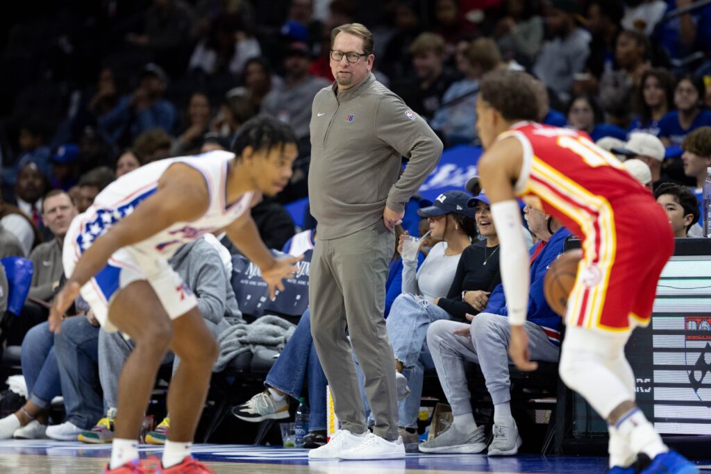 Jaden Springer guarding Trae Young as Nick Nurse looks on.