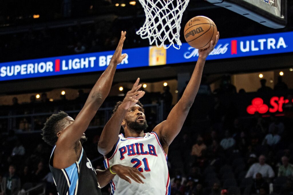 Joel Embiid shooting a layup.
