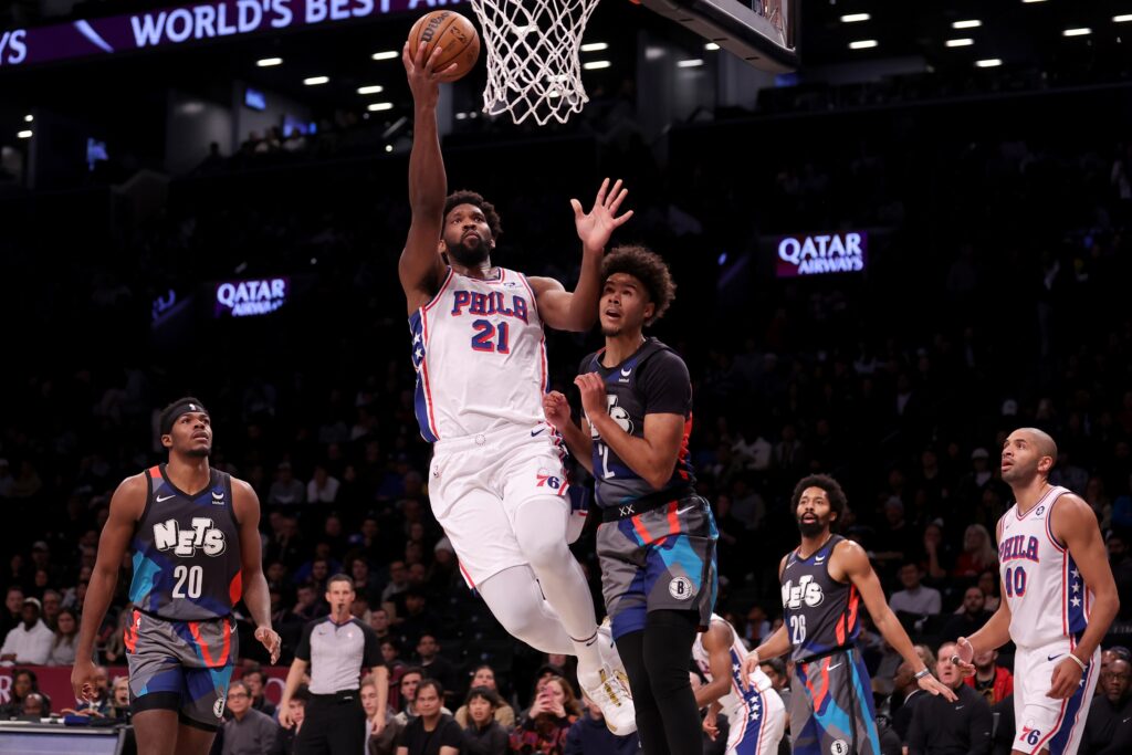 Joel Embiid drives for a layup against the Brooklyn Nets.