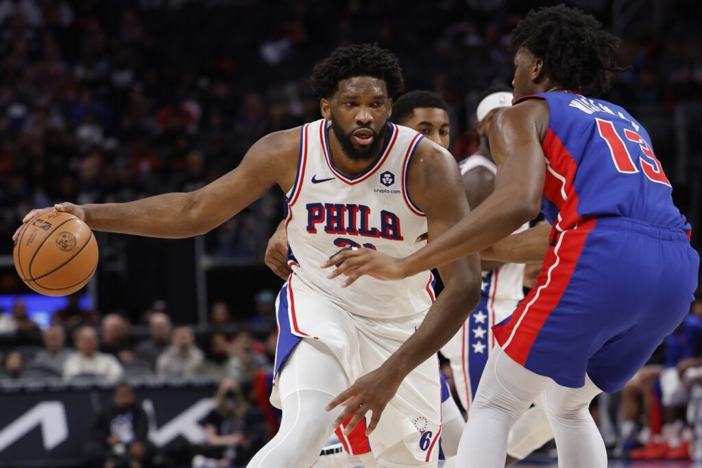 Joel Embiid attacking the basket against the Detroit Pistons.