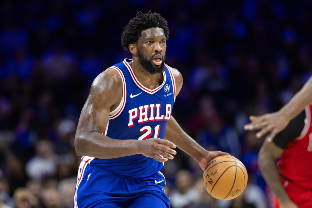 Joel Embiid dribbling a basketball.