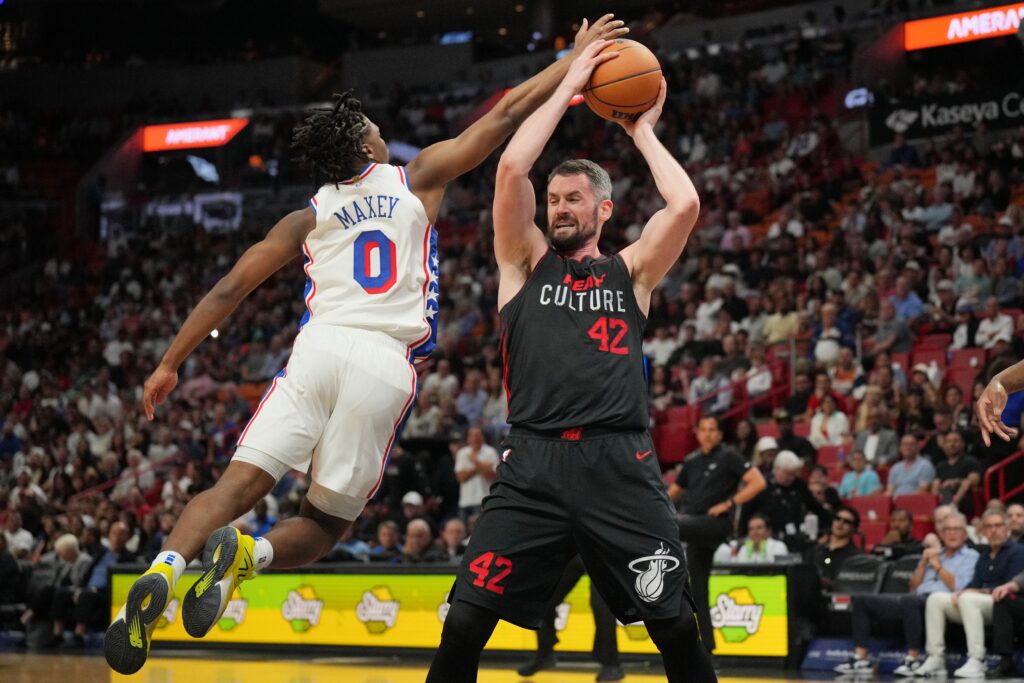 Tyrese Maxey blocking Kevin Love.