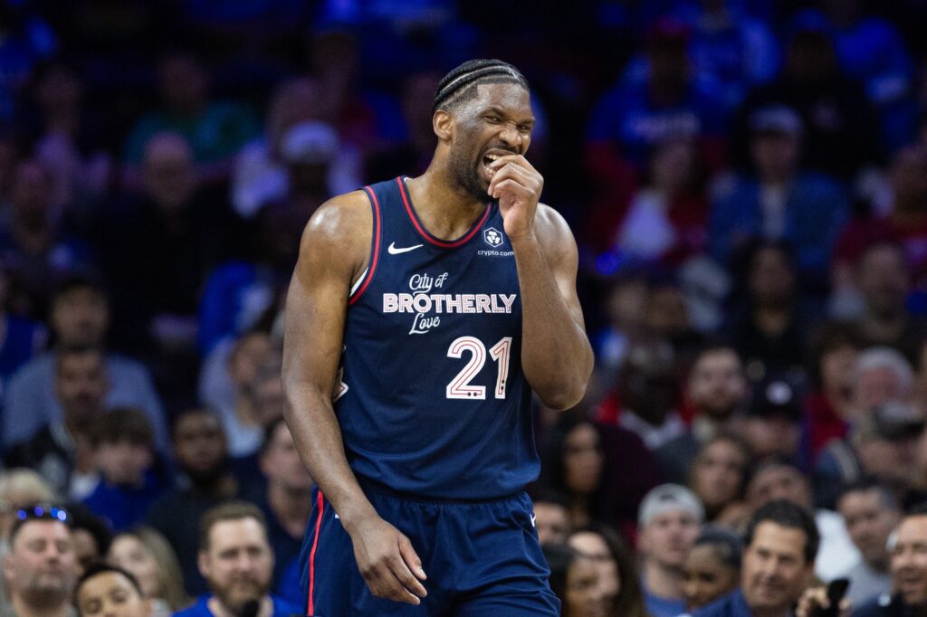 Joel Embiid grabbing at his mouth.