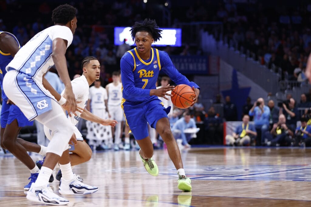 Bub Carrington dribbling a basketball.
