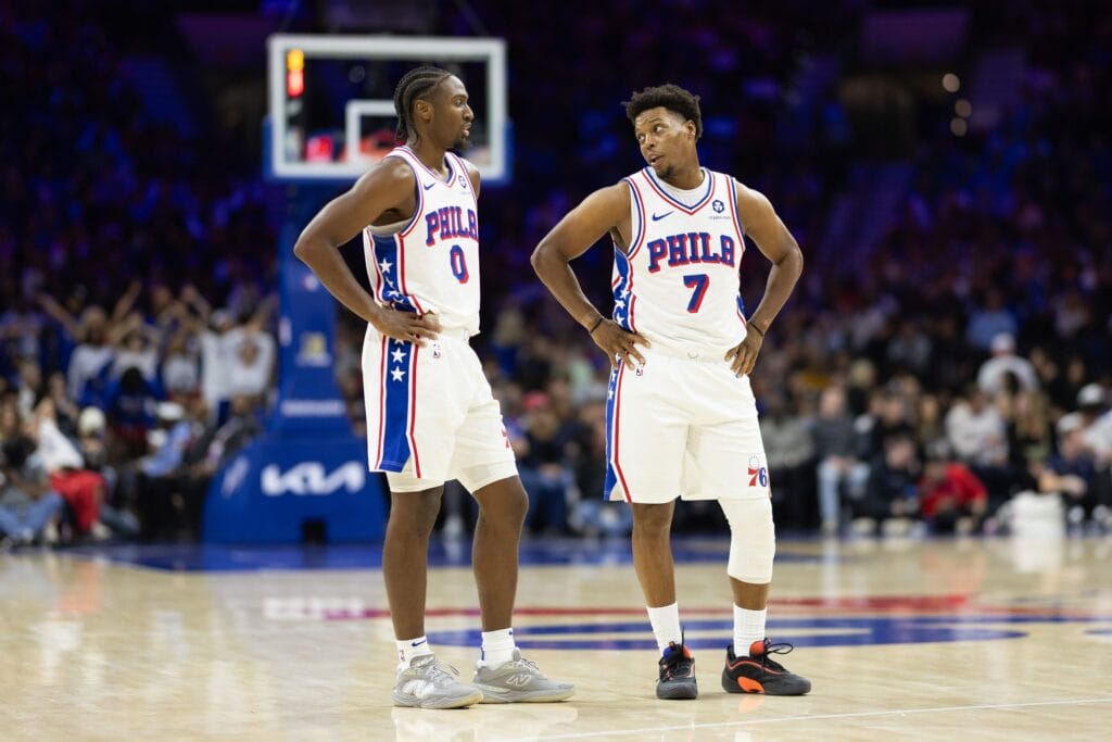 Tyrese Maxey talking with Kyle Lowry.