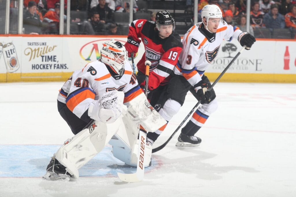 Phantoms Helge Grans (3) and Cal Petersen (40) prepare for a looming shot.