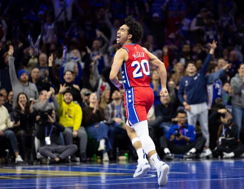 Jared McCain screaming in celebration during the Sixers' win over the Nets in the NBA Cup.