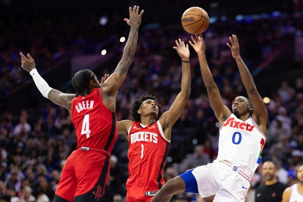 Tyrese Maxey shooting over two Rockets defenders.