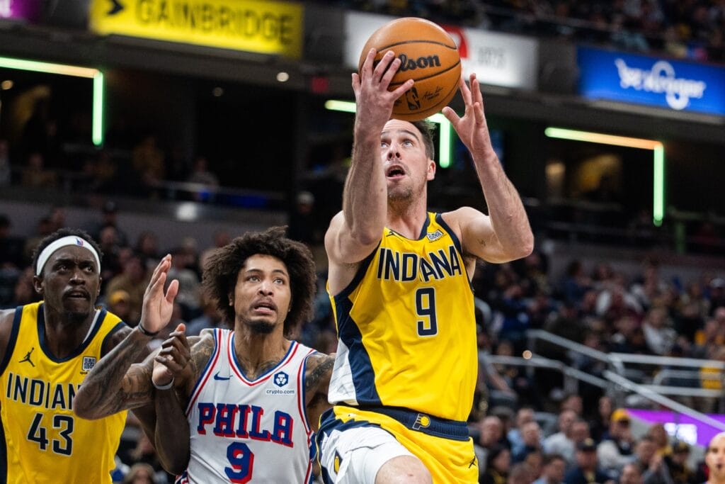 TJ McConnell driving against the Sixers.
