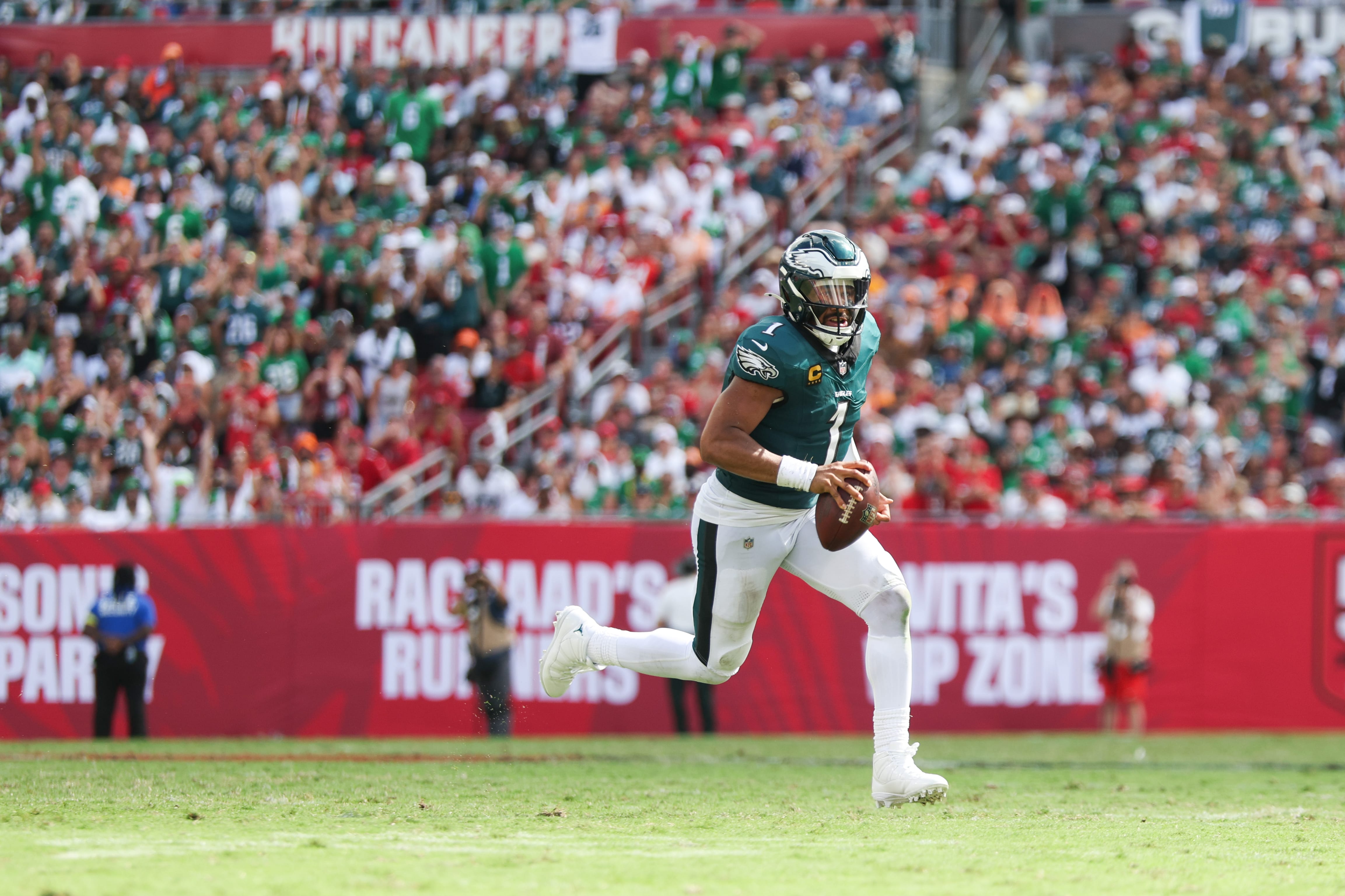 Eagles quarterback Jalen Hurts (1) runs with the ball during the third quarter against the Tampa Bay Buccaneers at Raymond James Stadium. Mandatory Credit: Nathan Ray Seebeck-Imagn Images