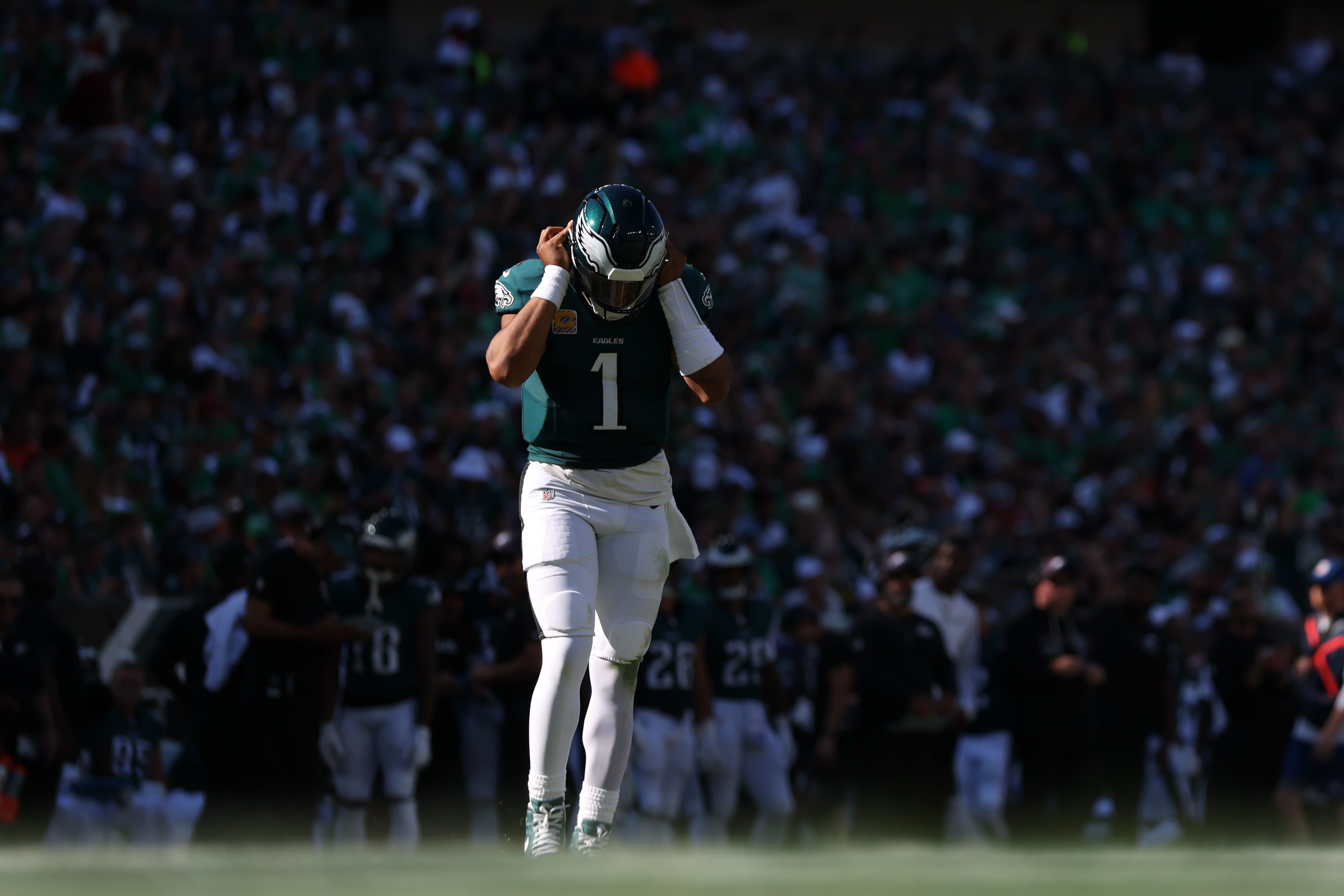 Eagles quarterback Jalen Hurts (1) walks onto the field after a break in action against the Denver Broncos during the third quarter at Lincoln Financial Field. Mandatory Credit: Bill Streicher-Imagn Images