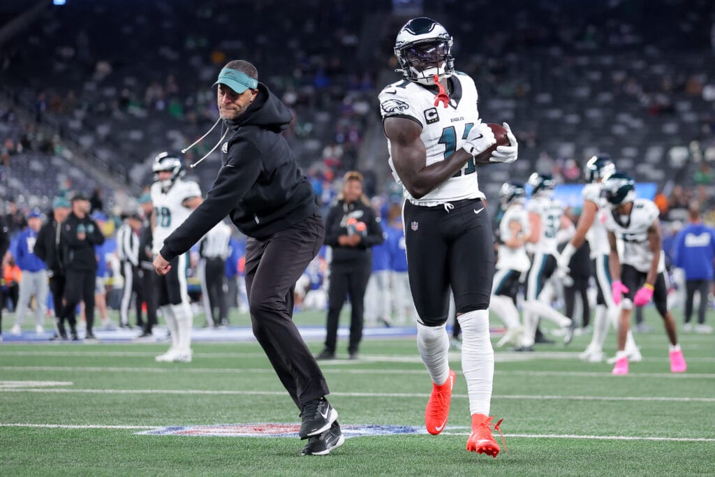 Eagles wide receiver A.J. Brown (11) warms up with wide receivers coach Aaron Moorehead prior to the game against the New York Giants at MetLife Stadium. Mandatory Credit: Brad Penner-Imagn Images