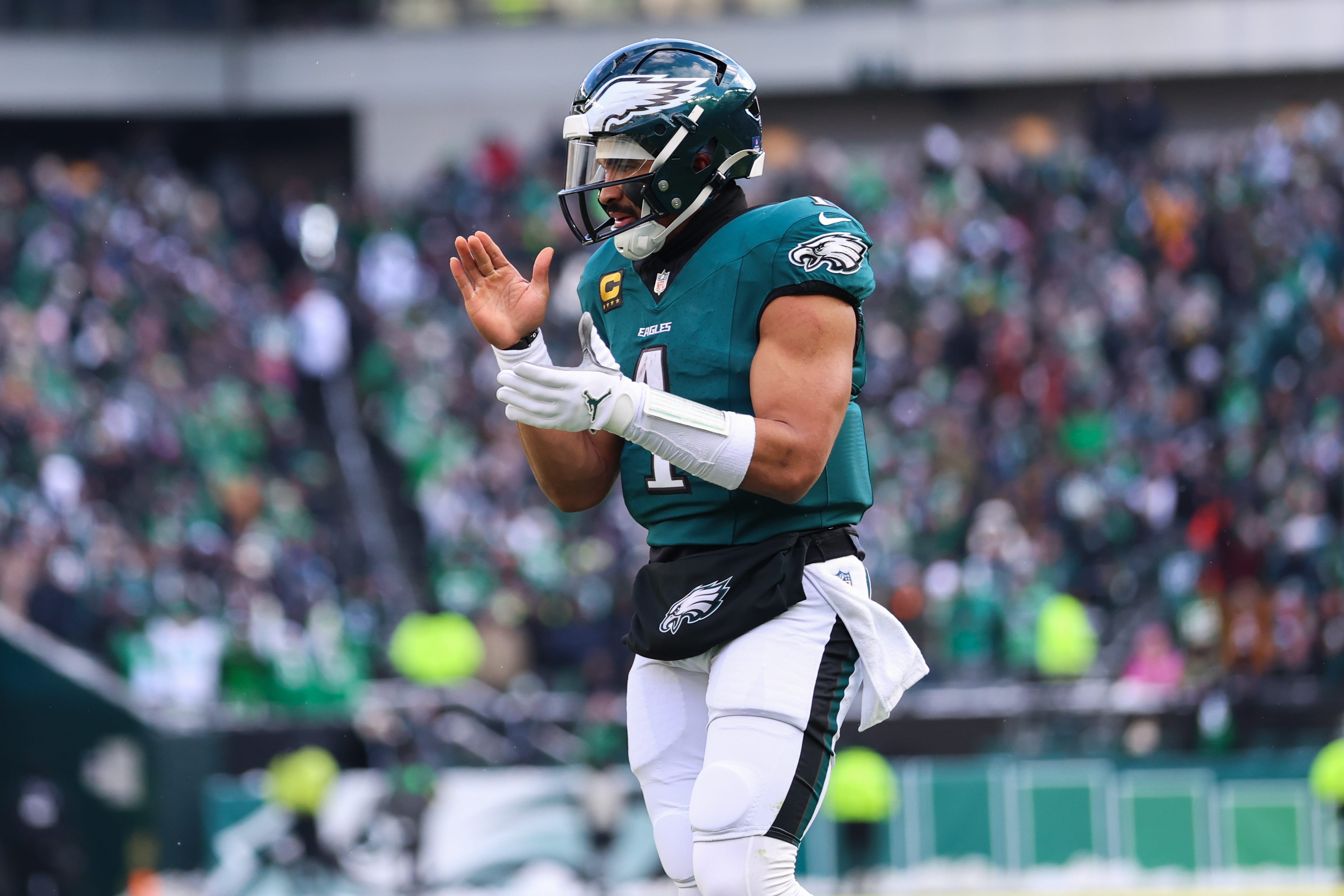 Eagles quarterback Jalen Hurts (1) reacts after running back Saquon Barkley (26) (not pictured) scores a touchdown against the Las Vegas Raiders during the second quarter at Lincoln Financial Field. Mandatory Credit: Bill Streicher-Imagn Images