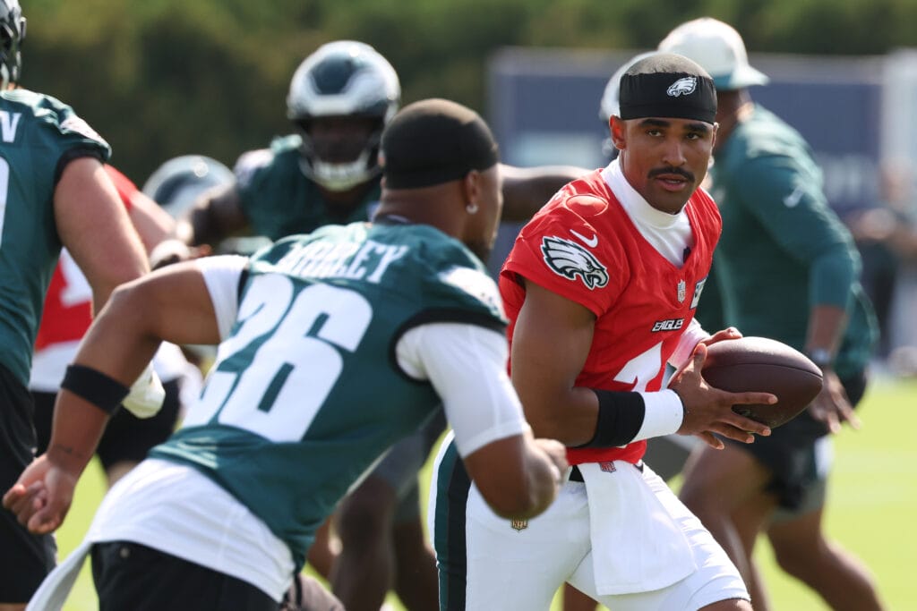 Eagles quarterback Jalen Hurts (1) hands off to running back Saquon Barkley (26) during training camp at Jefferson Health Training Complex. Mandatory Credit: Bill Streicher-Imagn Images