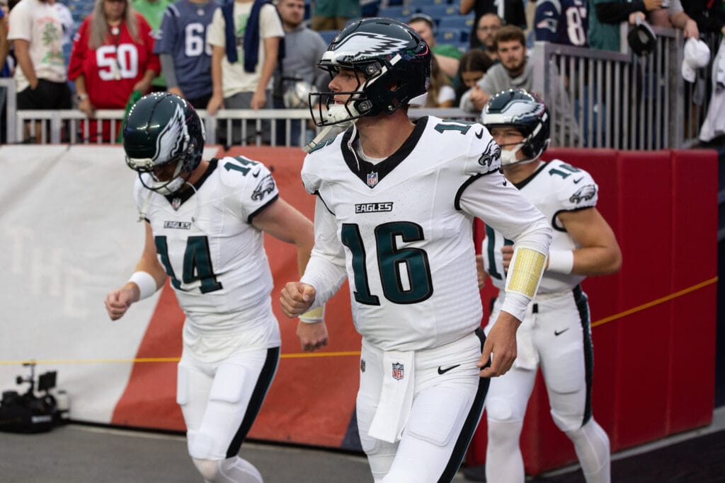 Eagles quarterback Tanner McKee (16) runs onto the field before the game against the New England Patriots at Gillette Stadium. Mandatory Credit: Edward Finan-Imagn Images
