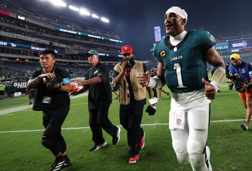 Eagles quarterback Jalen Hurts (1) runs off the field after the game against the Washington Commanders at Lincoln Financial Field. Mandatory Credit: Bill Streicher-Imagn Images