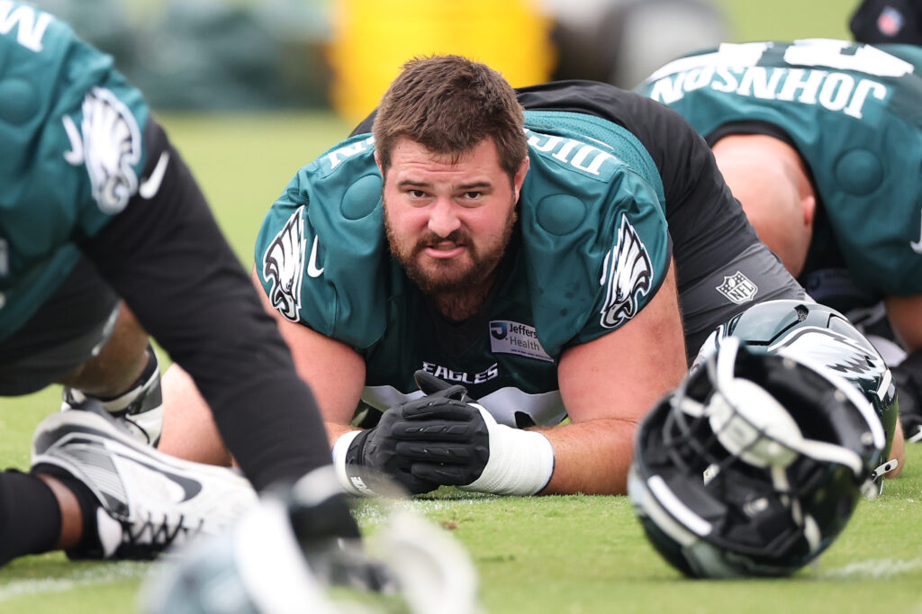 Eagles guard Landon Dickerson (69) stretches during minicamp at Jefferson Health Training Complex. Mandatory Credit: Bill Streicher-Imagn Images