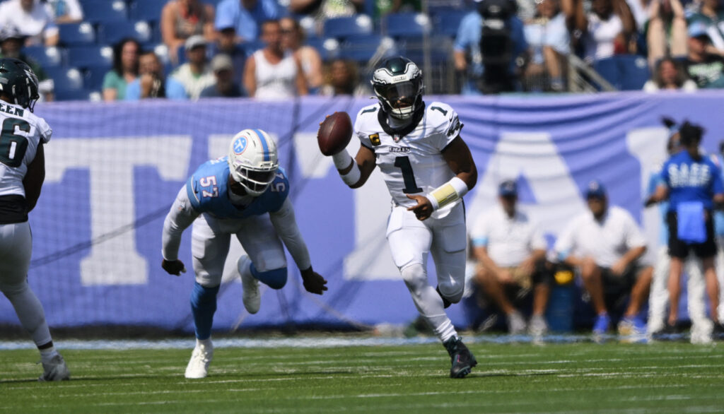 Eagles quarterback Jalen Hurts (1) scrambles during the third quarter at Nissan Stadium. Mandatory Credit: Steve Roberts-Imagn Images